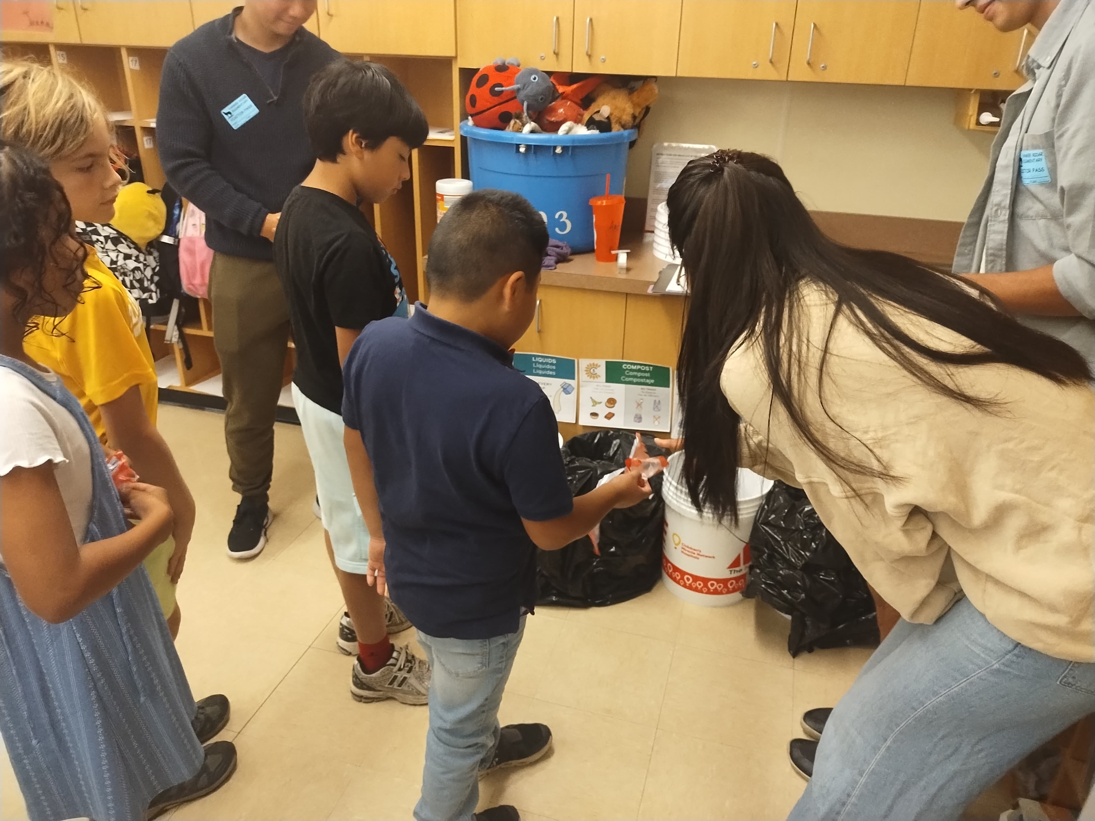 Students practicing waste sorting