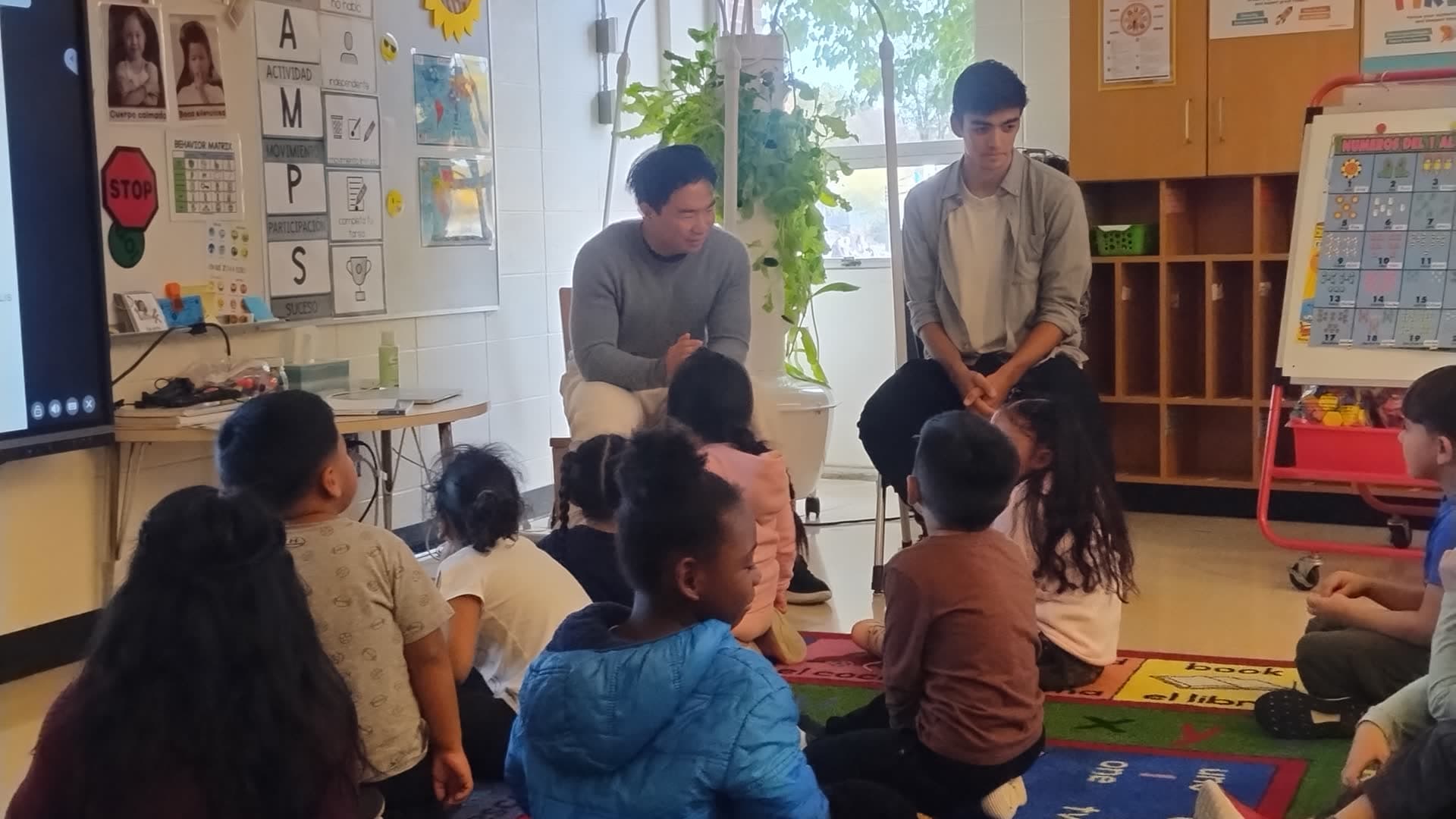 Kingfisher Composting co-founders teaching students in a classroom
